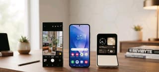 Samsung Galaxy S26 Ultra, A56, and Z Flip 7 lined up on a wooden desk showing their screen