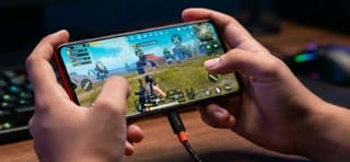 Gaming phone with bypass charging plugged in during a gameplay session