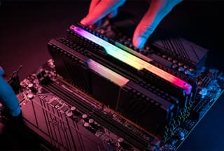 DDR5 RAM sticks installed in a gaming motherboard with RGB lighting