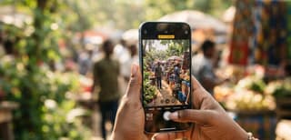 iPhone camera app open showing Photographic Styles and resolution controls