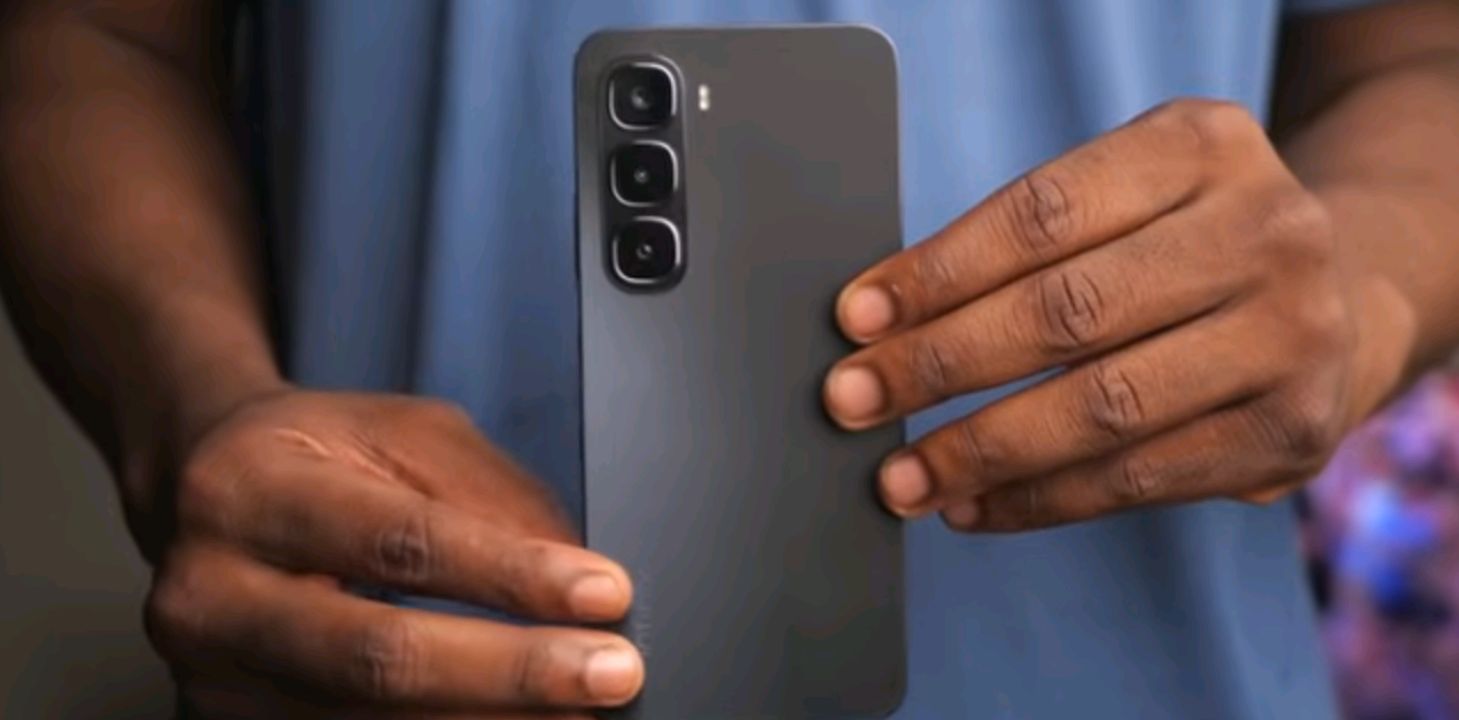 Three Infinix smartphones lined up on a desk, representing budget options under $150