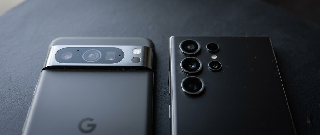 Person photographing food in a restaurant with a mid-range Android phone