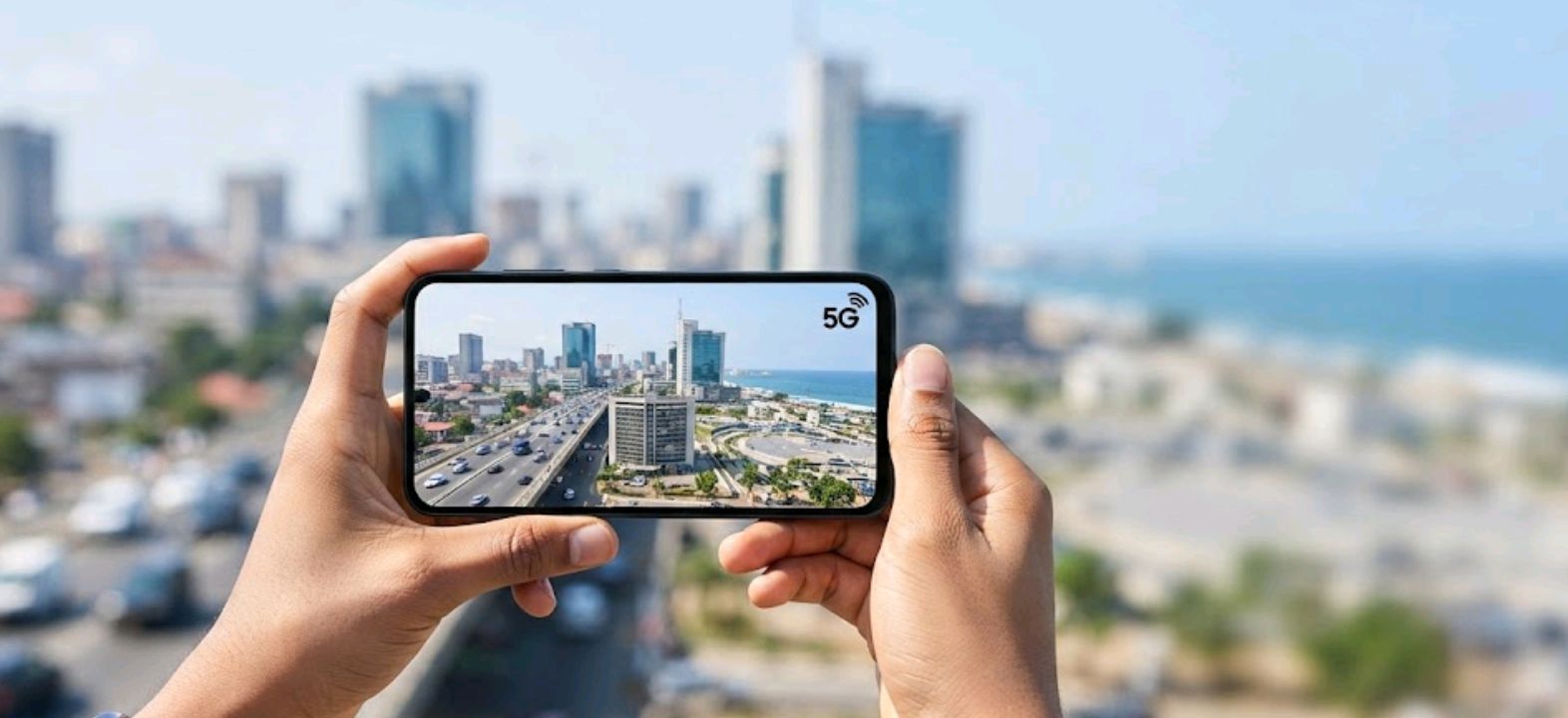 Hands holding a flagship smartphone outdoors with a cityscape in the background