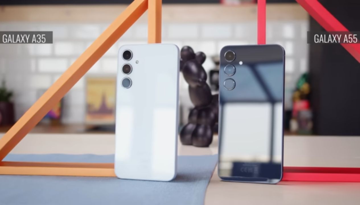 Samsung Galaxy A55 and A35 placed side by side on a wooden desk for comparison