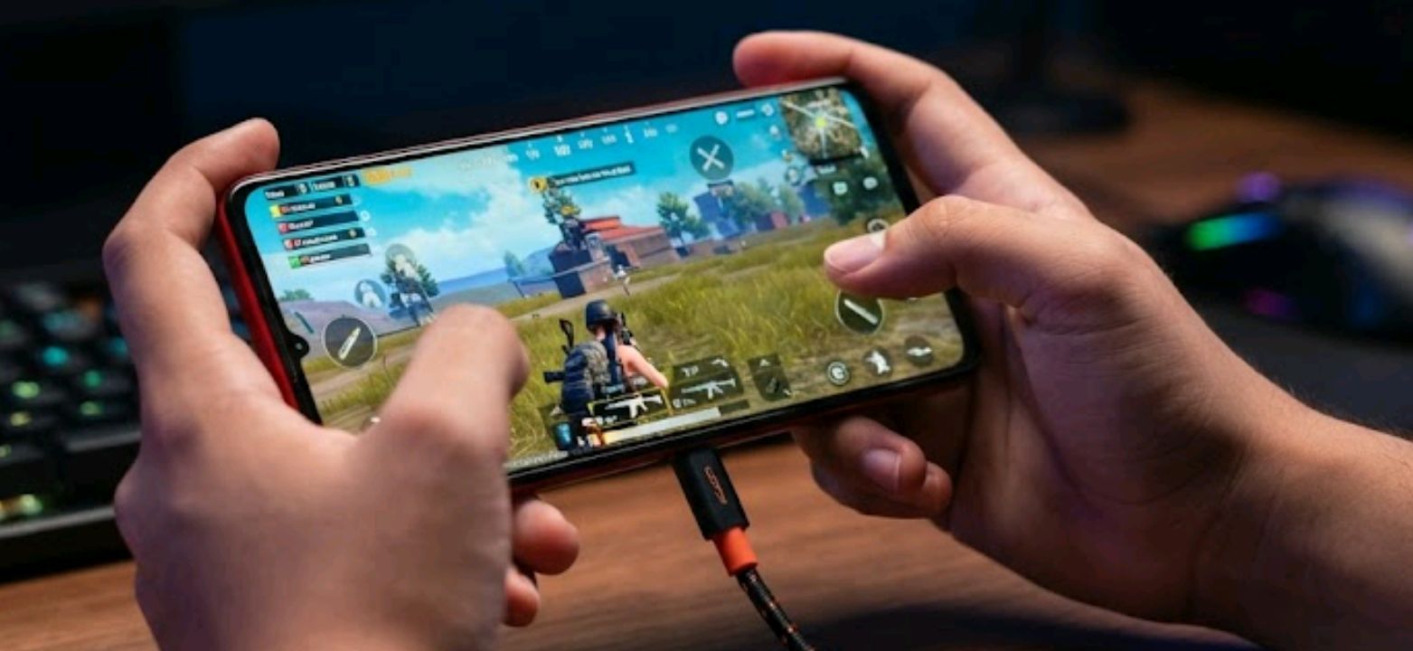 Gaming phone with bypass charging plugged in during a gameplay session