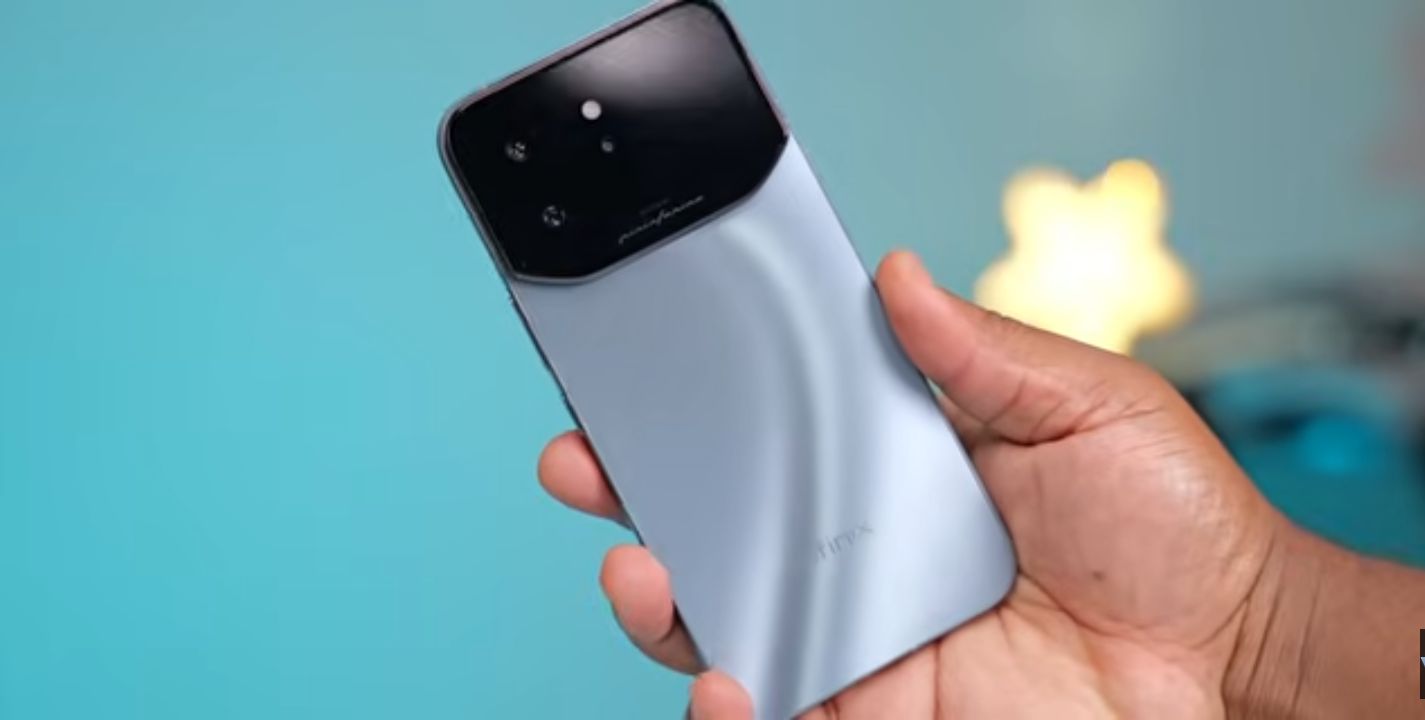 Infinix Note 60 Ultra resting on its car-shaped magnetic wireless charging stand