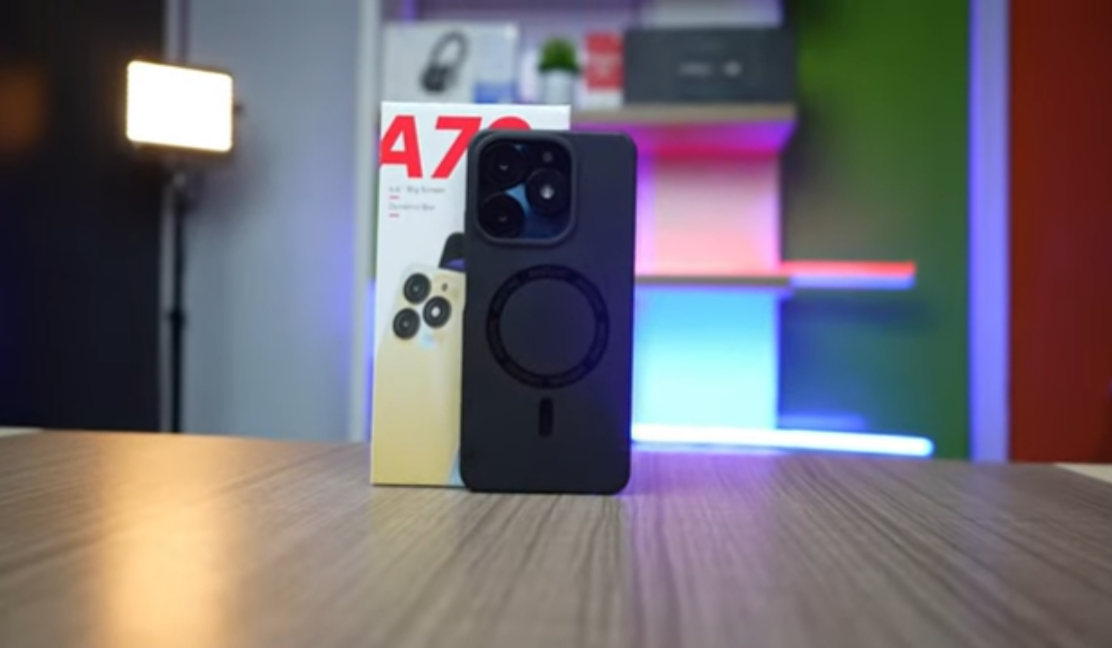 itel A70 on a wooden desk showing the front screen and camera design