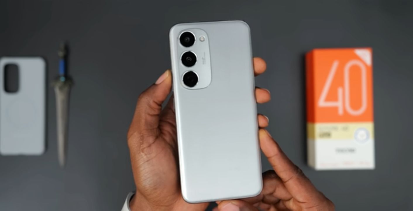 Phone with a magnetic wireless charging case attached, charging puck nearby