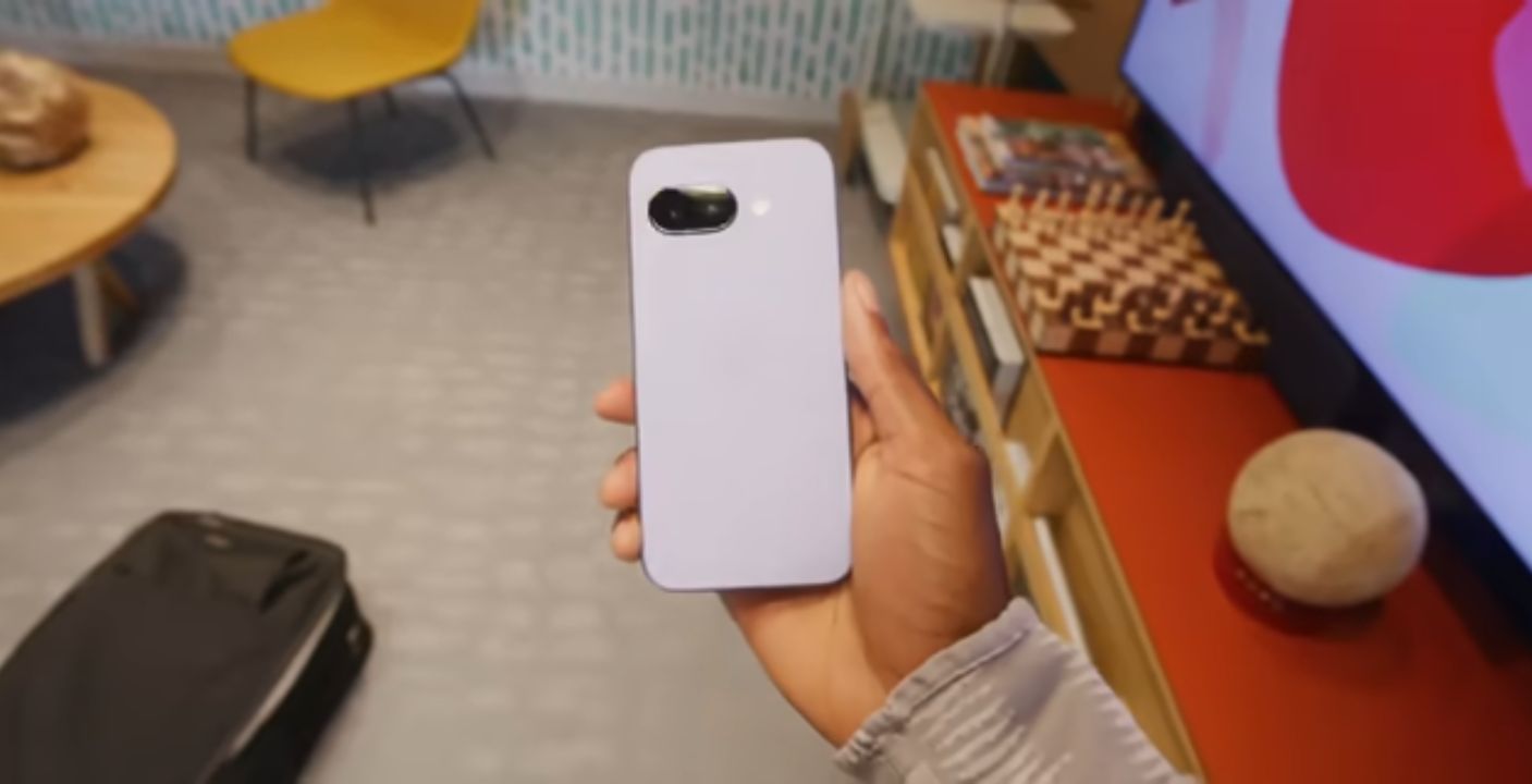 Google Pixel 9a in Iris color on a wooden desk