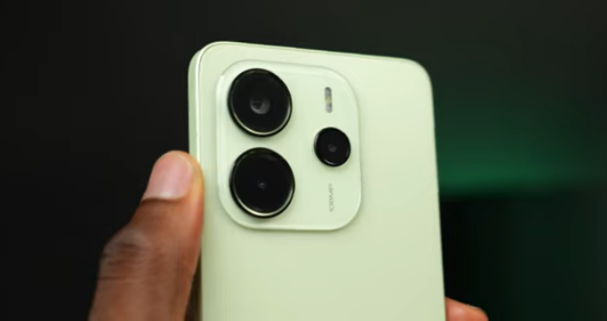 Redmi Note 14 held in hand against a blurred background, looking sleek but hiding its limitations