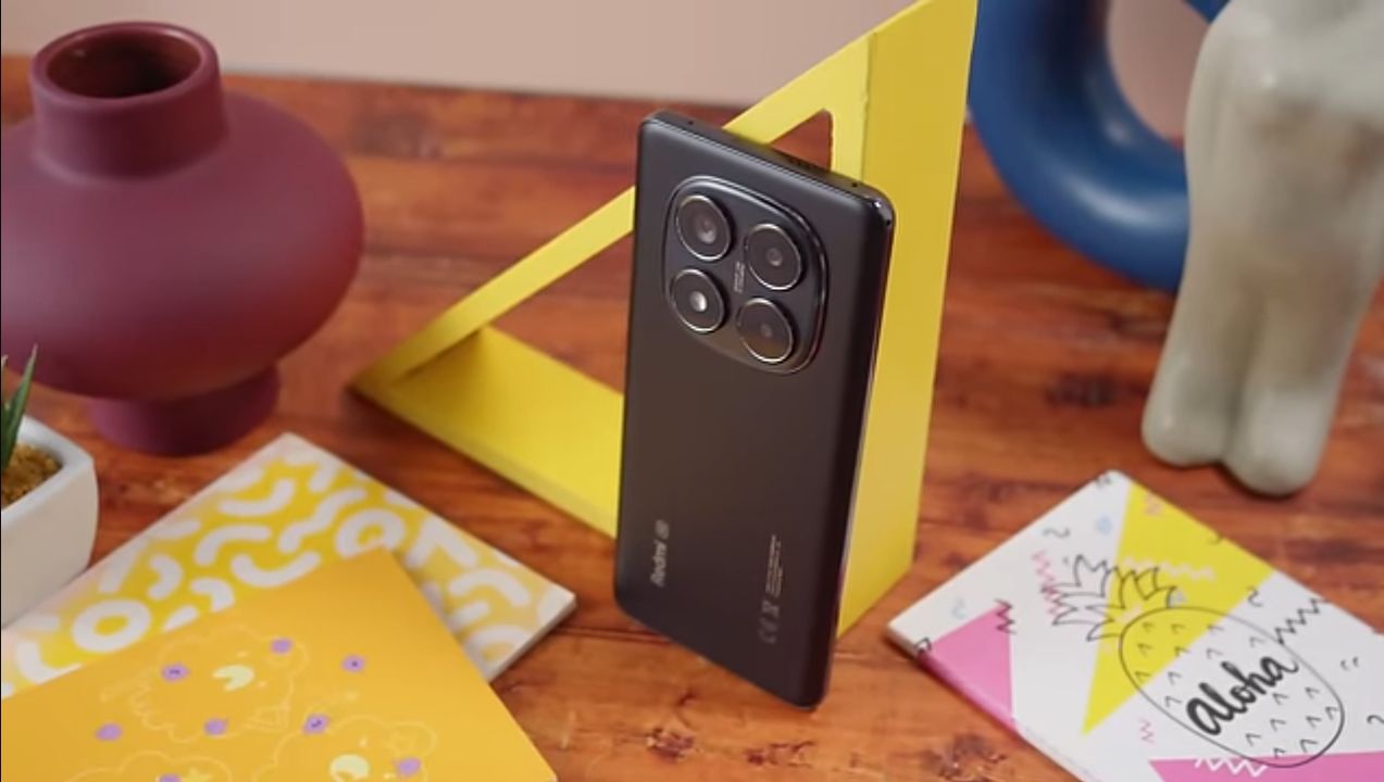 Redmi Note 14 Pro 5G front and back view showing the AMOLED display and triple camera module