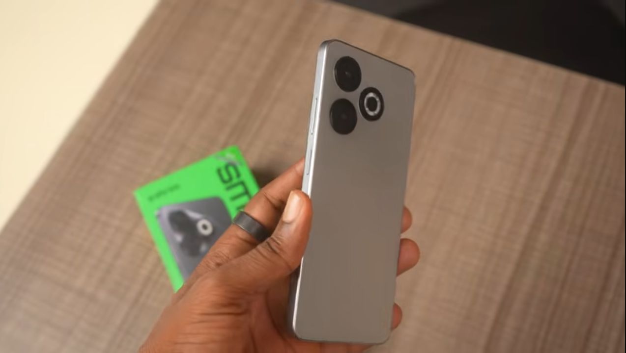 Infinix Smart 10 HD held in hand to show its screen size for scale