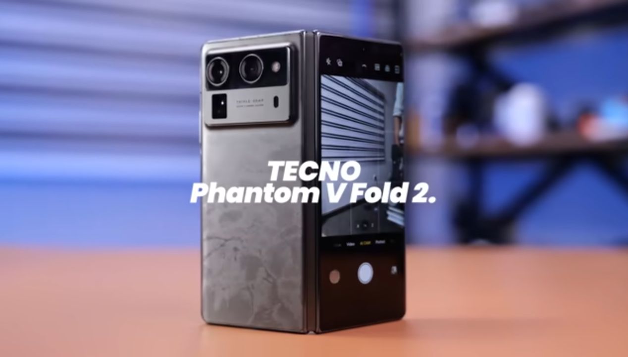 Tecno Phantom V Fold 2 open flat showing the stylus resting beside the inner display