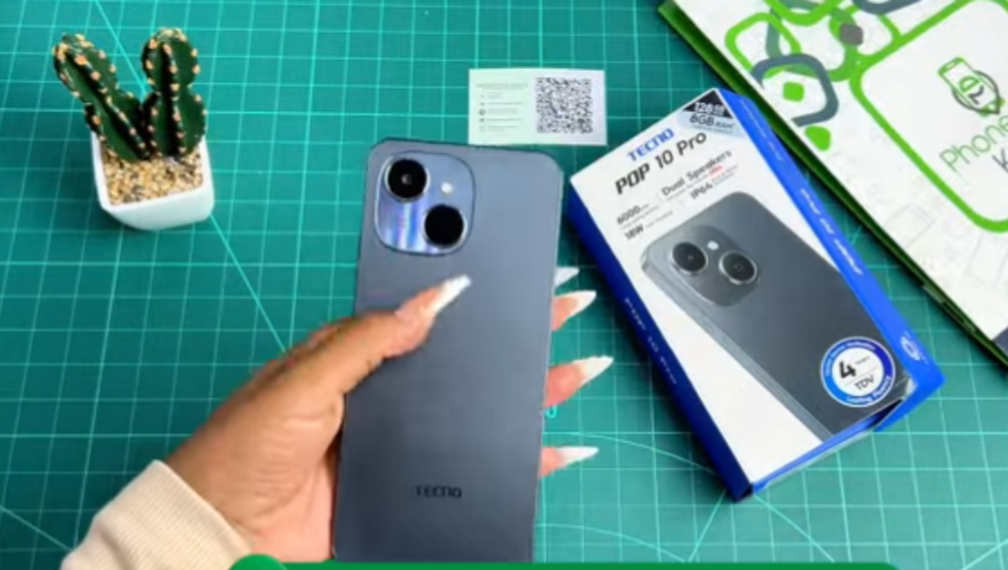 Tecno Pop 10 Pro in Ink Black showing its camera module and display on a clean neutral surface