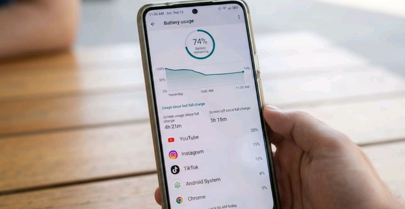 A person checking their phone's battery percentage and screen-on time in Android settings